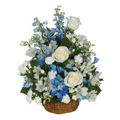 Blue and white floral arrangement in a wicker basket