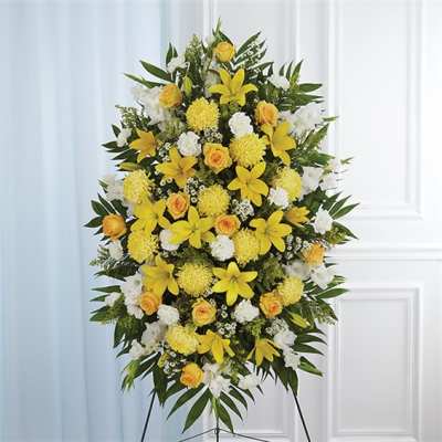 Yellow and white standing floral spray on an easel