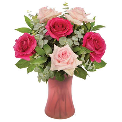Bouquet of pink and pale pink roses in a pink vase