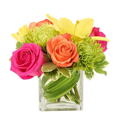Colorful bouquet of roses, lilies, and green mums in a clear glass vase