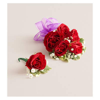 Red rose corsage and matching boutonniere with purple ribbon