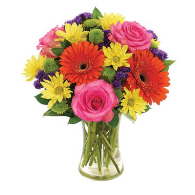 Bouquet of pink roses, orange gerbera daisies, and yellow daisies in a glass vase
