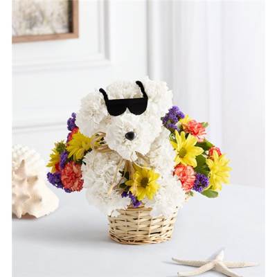 White teddy bear made of flowers in a wicker basket with colorful blooms