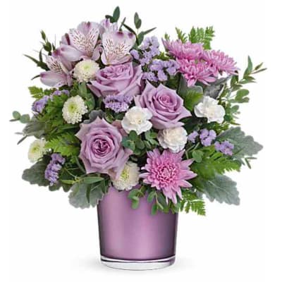 Lavender roses and pink chrysanthemums in a purple vase