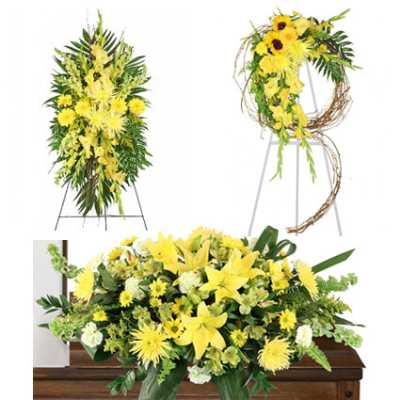 Yellow floral funeral tribute on a casket with matching standing sprays