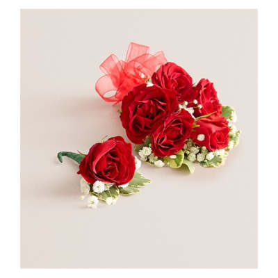 Red rose corsage and matching boutonniere with white baby's breath