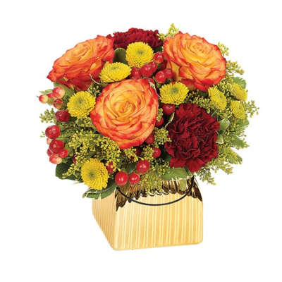 Bouquet of orange roses, red carnations, and yellow mums in a gold vase