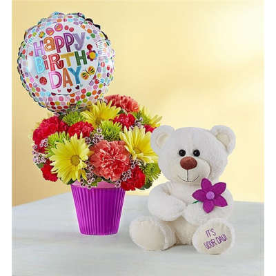 Birthday balloon with a colorful flower arrangement and a white teddy bear