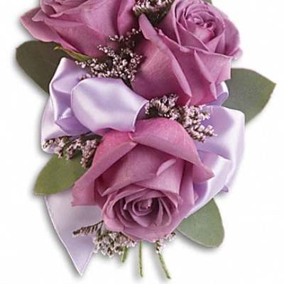 Lavender rose corsage with satin ribbon and small filler flowers