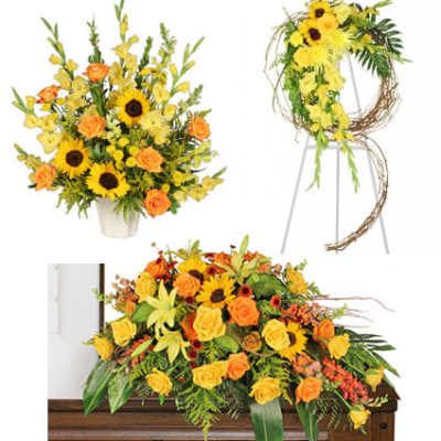 Yellow and orange floral funeral arrangements displayed around a casket