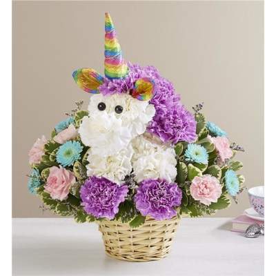 Unicorn-themed flower basket with a rainbow horn and pastel blooms