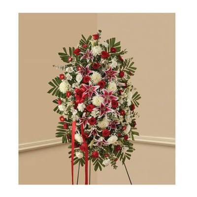 Standing floral spray with red and white flowers on an easel