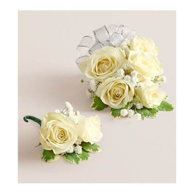 Cream rose corsage and boutonniere with silver ribbon and green accents