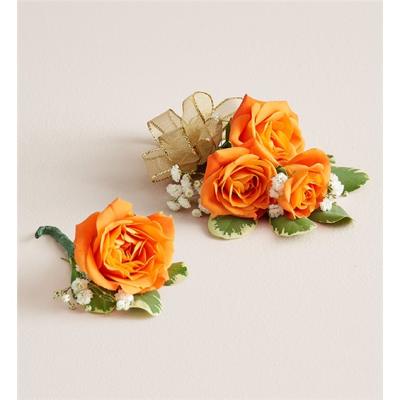 Orange rose corsages with small white flowers and ribbon