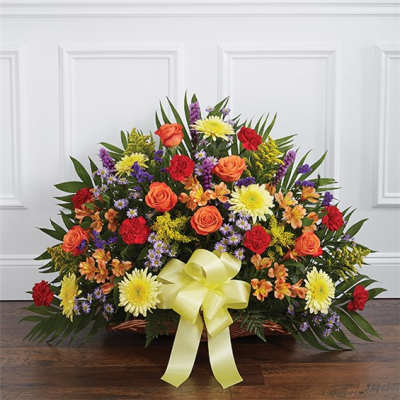 Mixed flower basket with a yellow ribbon bow