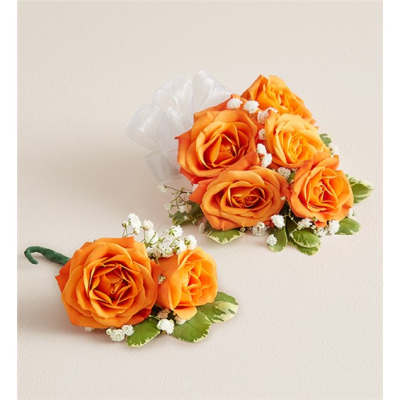 Orange rose corsage and boutonniere with white baby's breath and ribbon