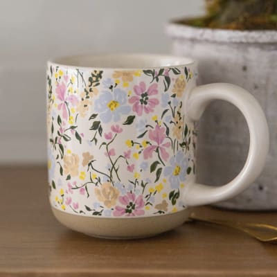 Floral-patterned ceramic mug with a large handle