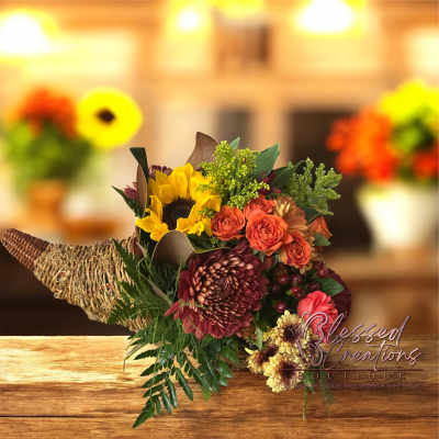 Autumn bouquet with sunflowers, orange roses, and burgundy mums