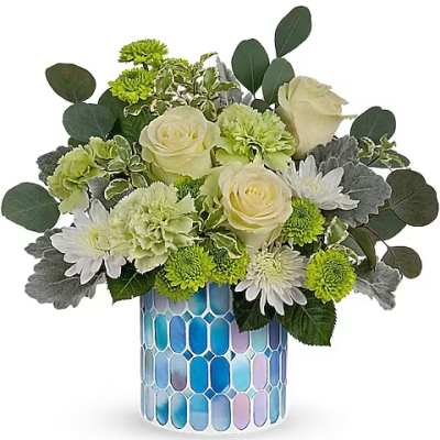 White roses and green mums in a blue mosaic vase