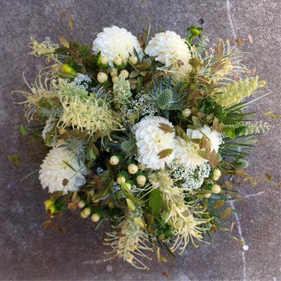 White dahlia bouquet with pale yellow accents and mixed greenery