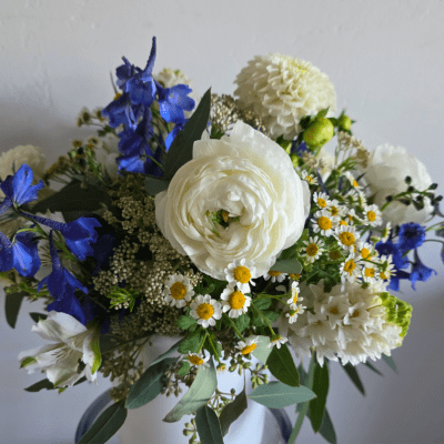 Bouquet of white and blue flowers in a vase