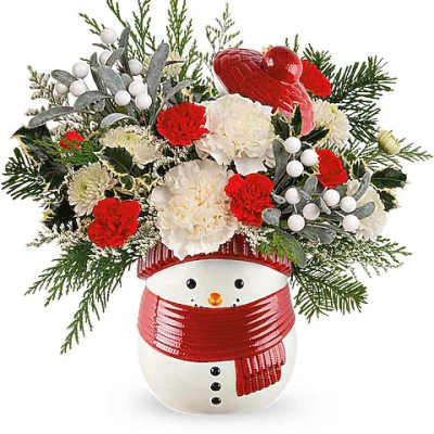 Snowman vase with red and white flowers and evergreen accents