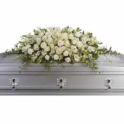 White rose casket spray on a silver casket