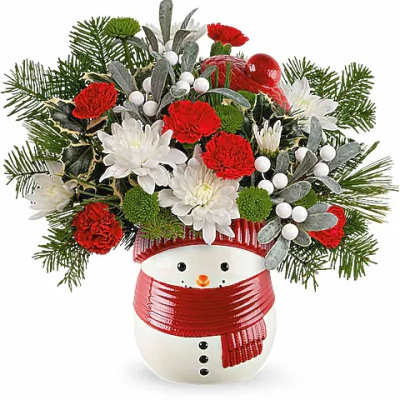 Snowman vase with red and white flowers and evergreen accents