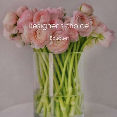 Pink ranunculus bouquet in a clear glass vase