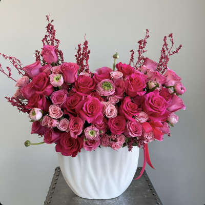 Pink rose bouquet in a white vase