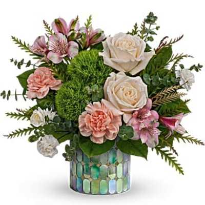 Bouquet of pink and white flowers in a mosaic glass vase