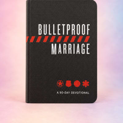 Black devotional book titled "Bulletproof Marriage" on a pastel background.