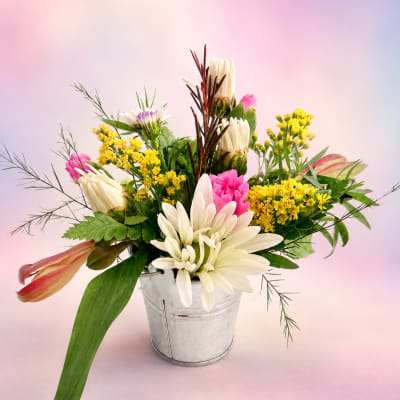 Mixed bouquet in a metal bucket with white and pink flowers