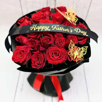 Bouquet of red roses with a Happy Father's Day ribbon