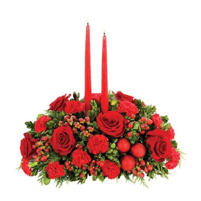 Red floral centerpiece with two tall red candles