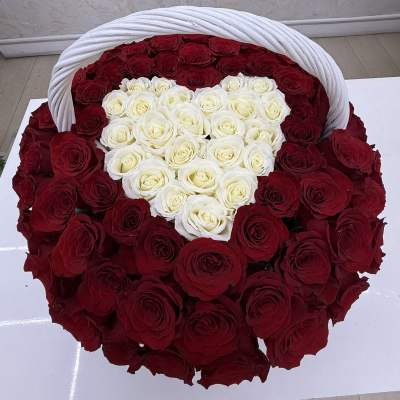 Heart-shaped basket filled with red and white roses
