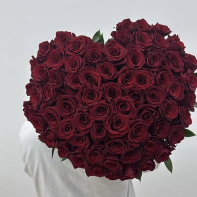Large heart-shaped bouquet of deep red roses
