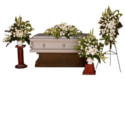 White funeral casket with floral sprays and standing arrangements