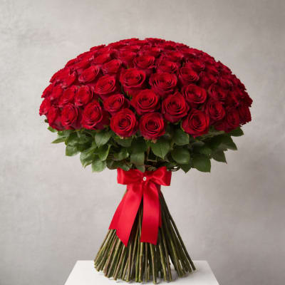 Large bouquet of red roses tied with a red ribbon