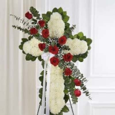 Standing floral cross with red roses and white flowers