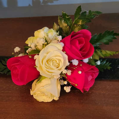 Bouquet of red and white roses with small white filler flowers