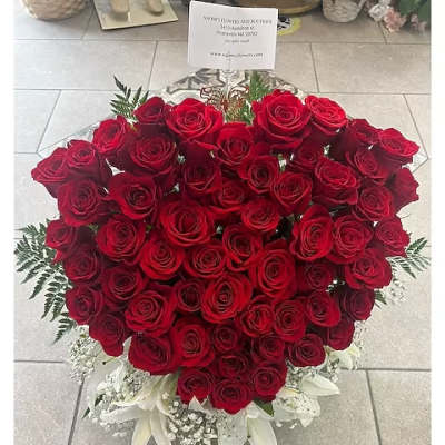 Large heart-shaped bouquet of red roses with white lilies