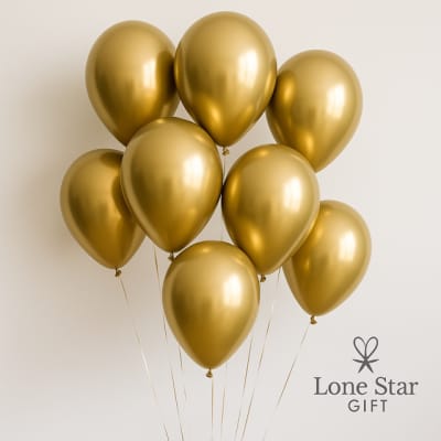 Cluster of metallic gold balloons against a plain background
