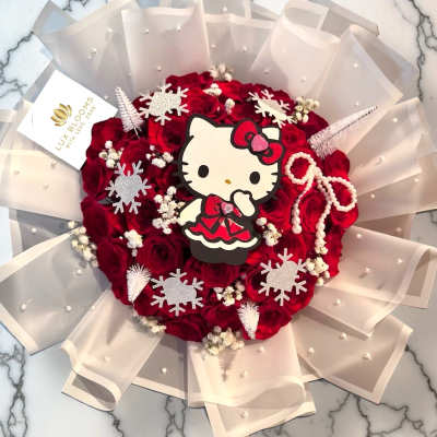 Red rose bouquet with Hello Kitty topper and pearl-accented wrap