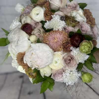 Round bouquet of blush, white, and brown flowers
