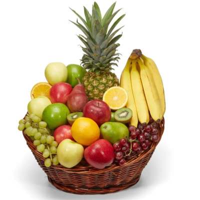 Fruit basket with bananas, pineapple, apples, grapes, oranges, and kiwi