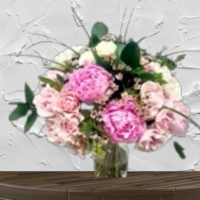 Pink and white bouquet in a glass vase