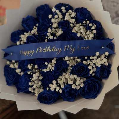 36 blue roses and baby breath