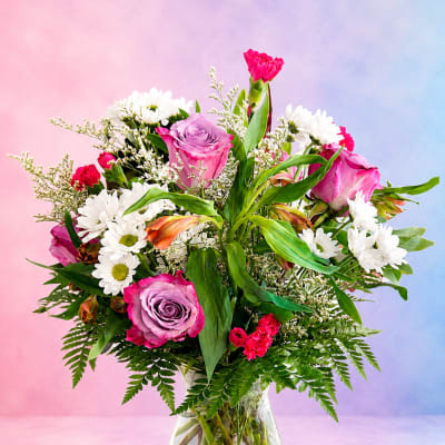 Pink and white mixed bouquet in a clear glass vase