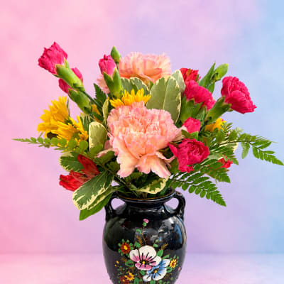 Colorful bouquet in a black painted vase